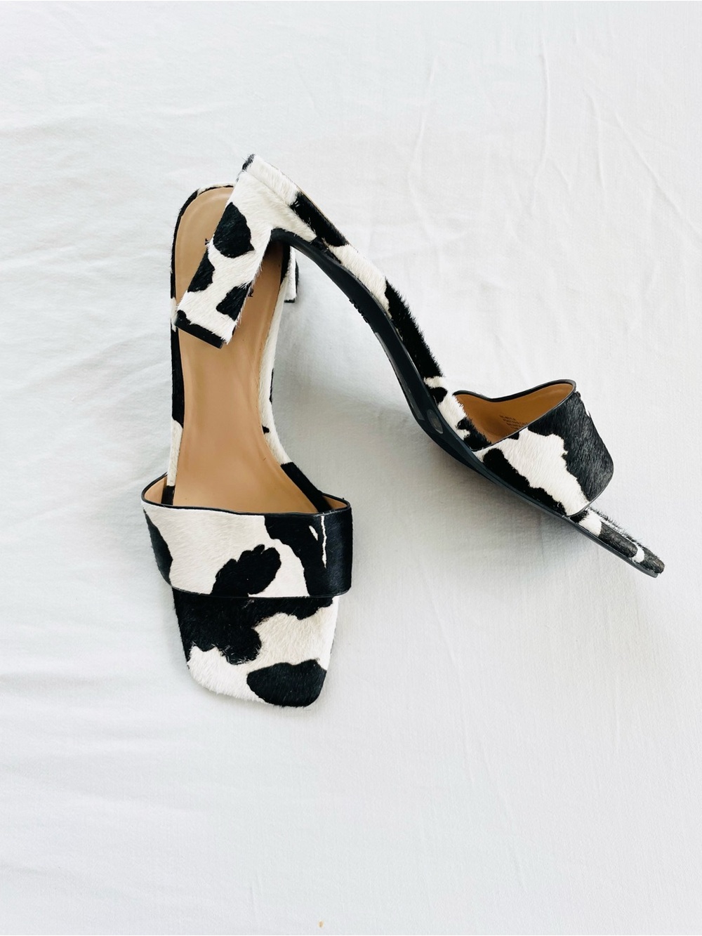 NWOT INC blk/white cowhide slip on mule heels. Sz 7.5. Never worn